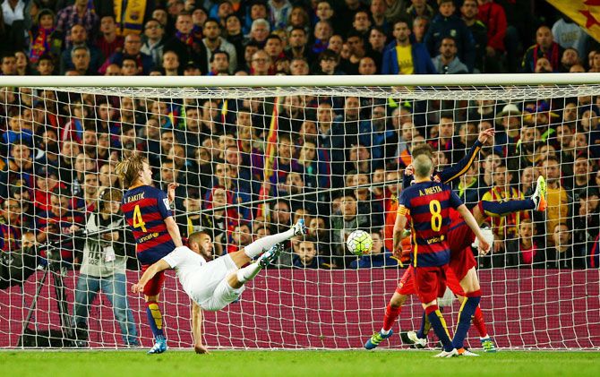 Real Madrid’s Karim Benzema scores the equaliser against FC Barcelona during their El Clasico encounter at the Camp Nou in Barcelona on Saturday