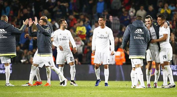 Real Madrid's Cristiano Ronaldo celebrates with Gareth Bale, Casemiro, Jese and teammates after the match