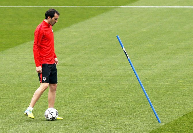 Atletico Madrid's Diego Godin takes part in a training session on Monday