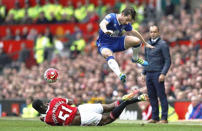 Everton's Leighton Baines in action with Manchester United's Timothy Fosu Mensah 