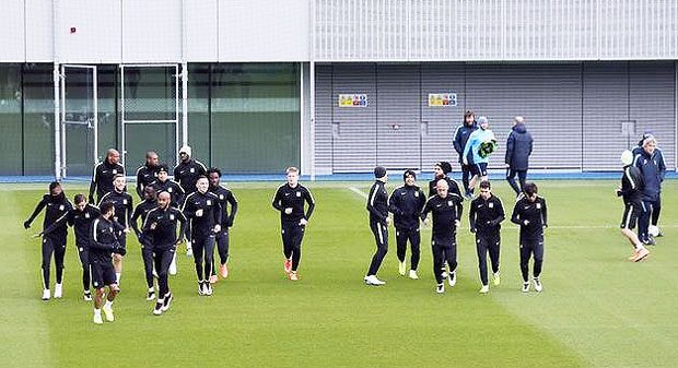 Manchester City players go through the grind during a training session at City Football Academy