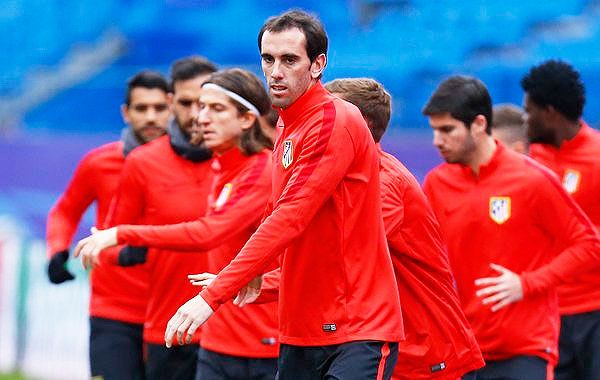 Atletico's Diego Godin and teammates at a training session in Madrid on Tuesday