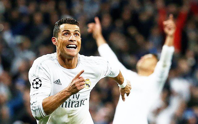 Real Madrid's Cristiano Ronaldo celebrates scoring their third goal and his hat-trick against Wolfsburg on Tuesday