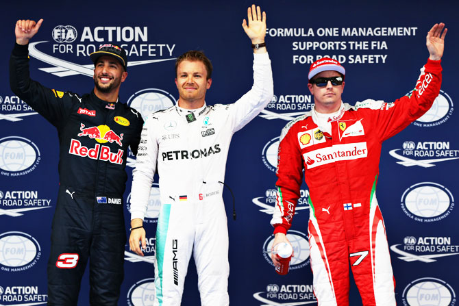  Germany and Mercedes GP's Nico Rosberg, Australia and Red Bull Racing's Daniel Ricciardo and Ferrari's Finnish driver Kimi Raikkonen celebrate in parc ferme after qualifying for the Formula One Grand Prix of China at Shanghai International Circuit in Shanghai on Saturday