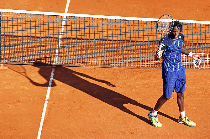 France's Gael Monfils waves to spectators after defeating his compatriot Jo-Wilfried Tsonga on Saturday