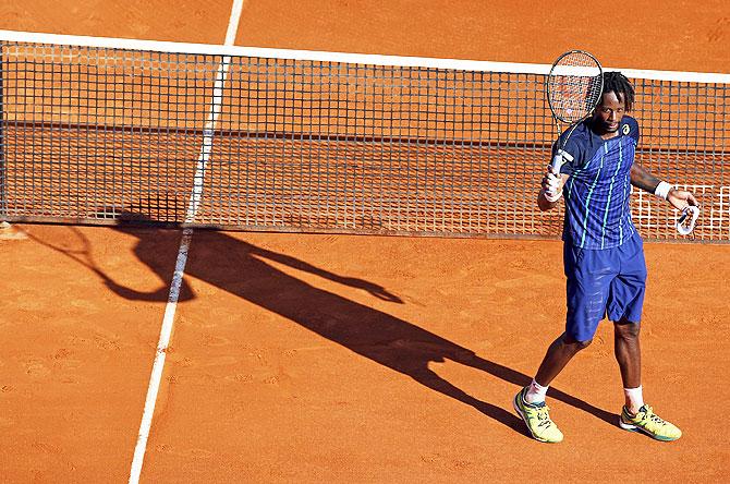 France's Gael Monfils waves to spectators after defeating his compatriot Jo-Wilfried Tsonga on Saturday