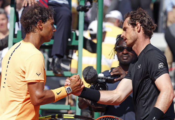 Rafael Nadal of Spain (L) shakes hands with Andy Murray 