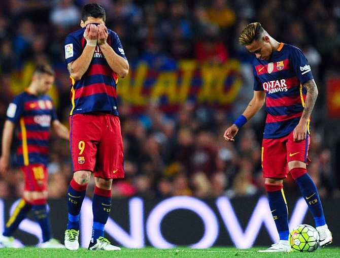 FC Barcelona’s Luis Suarez, left, and Neymar look on dejected after conceding a goal against Valencia at the Camp Nou on Sunday