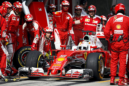 Ferrari driver Sebastian Vettel of Germany pulls out after a pit stop during the Chinese Grand Prix