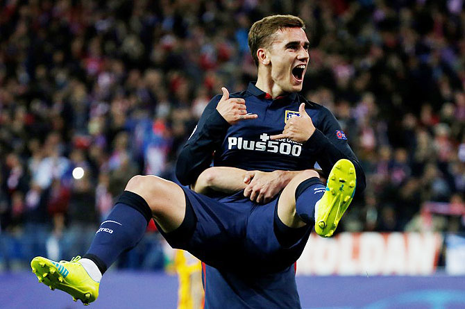 Atletico Madrid's Antoine Griezmann celebrates scoring their first goal against Barcelona during their UEFA Champions League, quarter-final second leg match at the Vincente Calderon Stadium on Wednesday, April 13