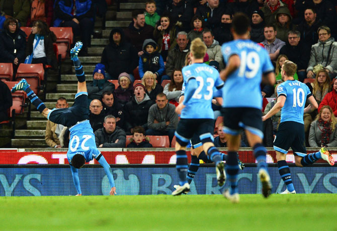 Tottenham Hotspur's Dele Alli does a somersault as he celebrates their second goal