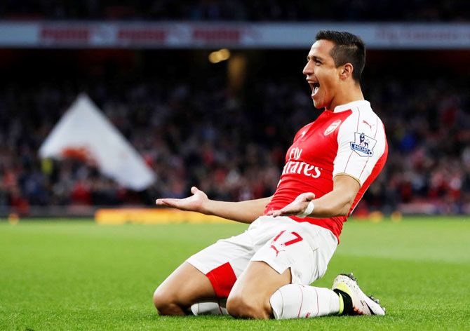 Arsenal's Alexis Sanchez celebrates scoring their first goal against West Bromwich Albion during their English Premier League match at Emirates Stadium in London on Thursday