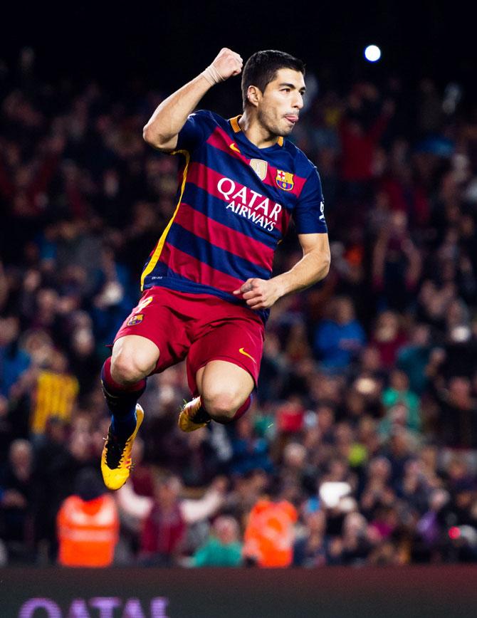 FC Barcelona's Luis Suarez celebrates after scoring his team's fourth goal against Sporting Gijon during their La Liga match at Camp Nou on in Barcelona on Saturday