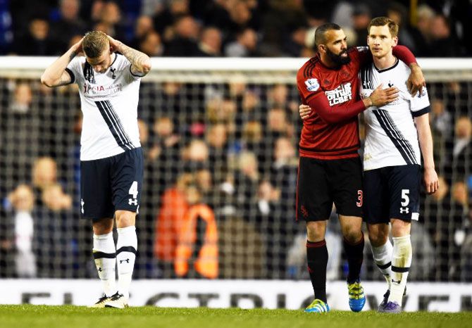 Tottenham's Toby Alderweireld (left) is dejected after the game as teammate Jan Vertonghen is consoled by West Brom's Sandro