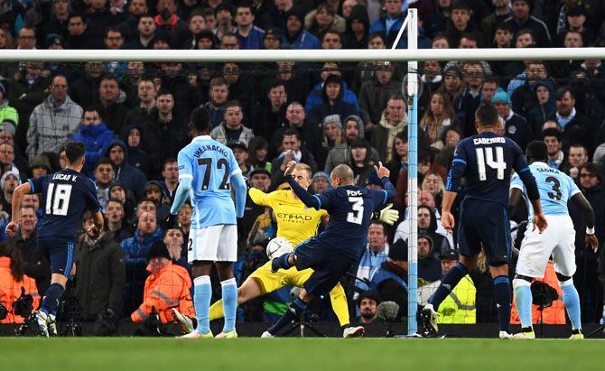 Manchester City's goalkeeper Joe Hart saves a point blank shot from Real Madrid's Pepe