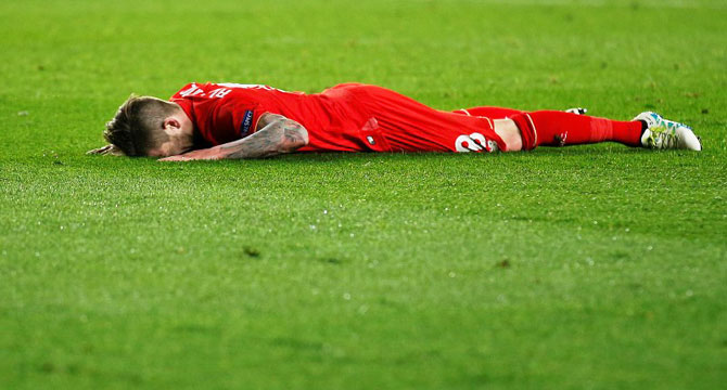 Liverpool's Alberto Moreno reacts after missing a scoring opportunity