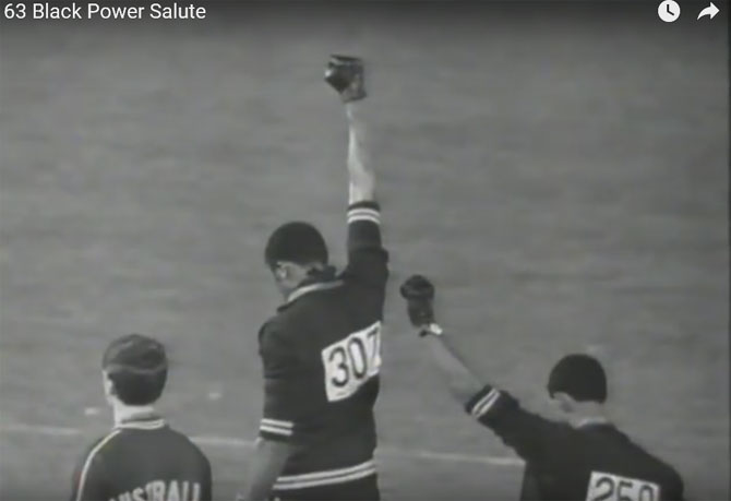Track athlete and silver medallist at the 1968 Mexico City Games, Peter Norman wore a badge supporting the "Olympic Project for Human Rights" while Tommie Smith and John Carlos raised black-gloved fists and bowed their heads during the U.S. national anthem, a potent gesture in the civil rights era.
