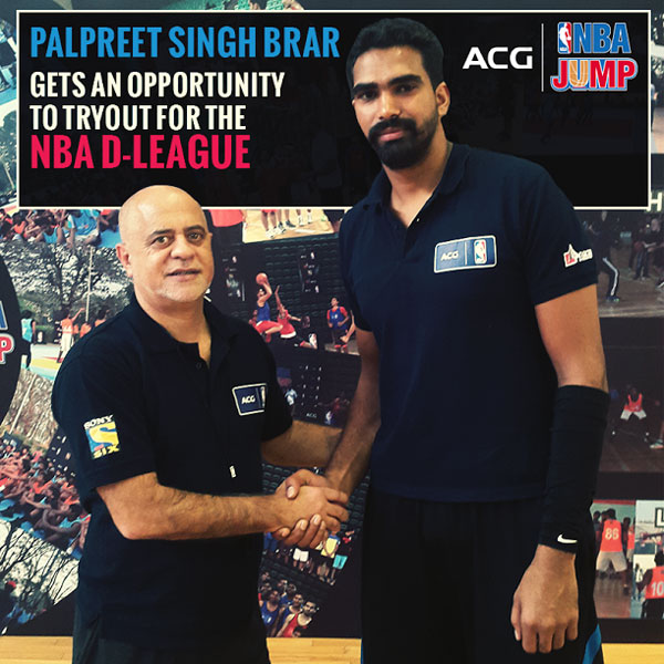 Palpreet Singh is congratulated by Carlos Barroca, NBA India, VP after winning the AGC-NBA national camp