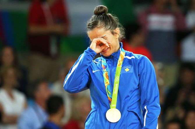 Kosovo's 52 kg woman judoka, Majlinda Kelmendi gets emotional on the podium after receiving her gold medal at the 2016 Rio Summer Olympics in Rio de Janeiro on Sunday