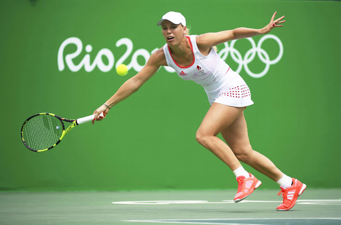 Denmark's Caroline Wozniacki in action against Czech Republic's Petra Kvitova during her women's singles first round match at the Rio Olympics on Monday