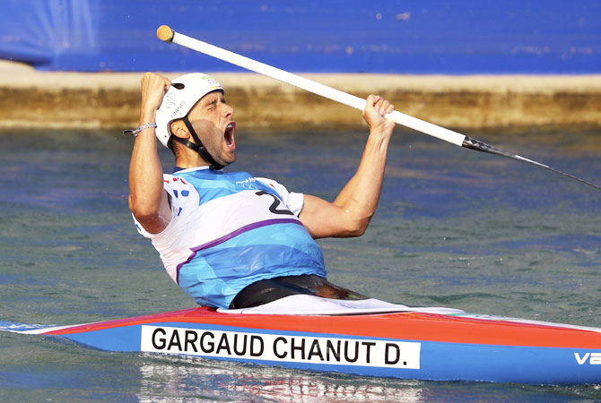 France's Denis Gargaud Chanut celebrates after winning the men's canoe single (C1) final for a gold at Whiteater stadium in Rio de Janeiro on Tuesday