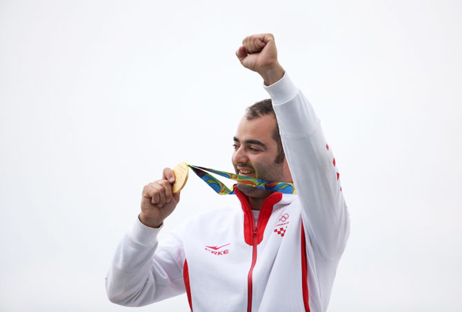 Josip Glasnovic of Croatia celebrates after taking gold in the Men's Trap shooting event at the Olympic Shooting Centre
