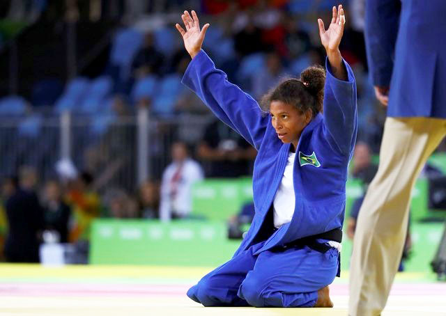 Brazil's Rafaela Silva celebrates after her gold medal win in the 57 kg Judo final on Monday