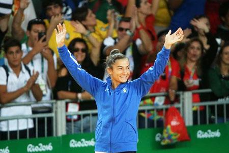 Kosovo's Majlinda Kelmendi Kosovo greets supporters after winning gold in the 52kg women's Judo event on Sunday