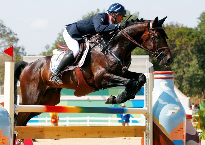 France's Karim Florent Laghouag riding Entebbe jumps during the eventing team jumping final at the Olympic Equestrian Centre in Rio de Janeiro on Tuesday