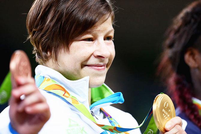 Gold medalist Tina Trstenjak of Slovenia poses on the podium during the medal ceremony for the Women's -63kg on Day 4 of the Rio 2016 Olympic Games at the Carioca Arena 2 in Rio de Janeiro on Tuesday