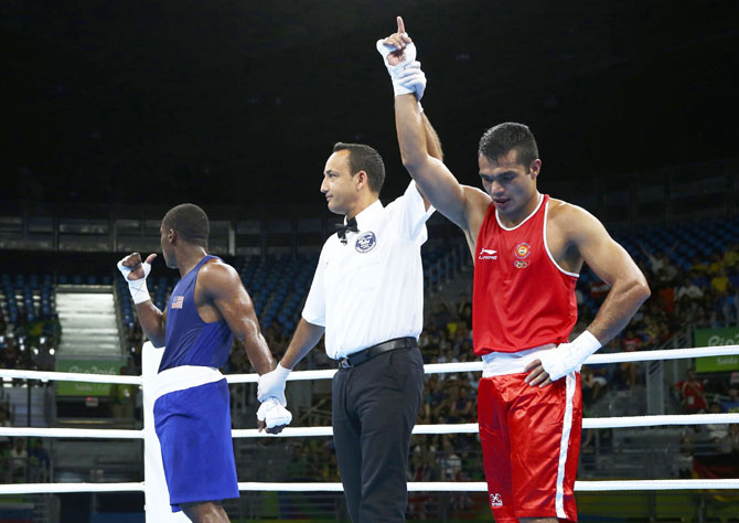 India's Vikas Krishan reacts after winning his bout against USA's Charles Conwell during their preliminary 75kg (middleweight) Round of 32 bout at Riocentro, Pavilion 6 in Rio de Janeiro on Tuesday