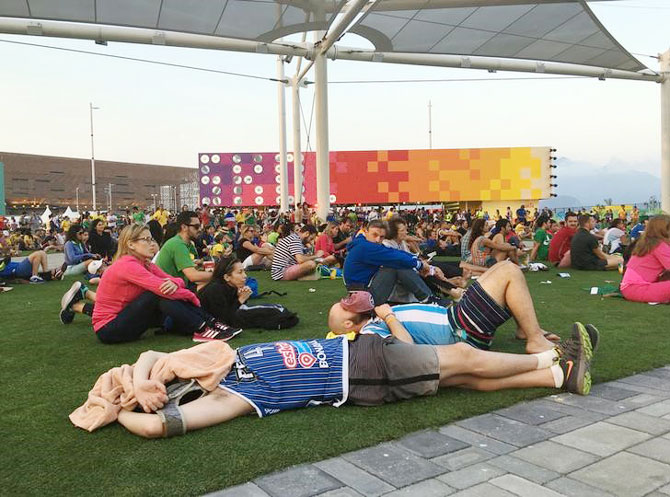 Fans grab 40 winks at the Olympic tennis centre
