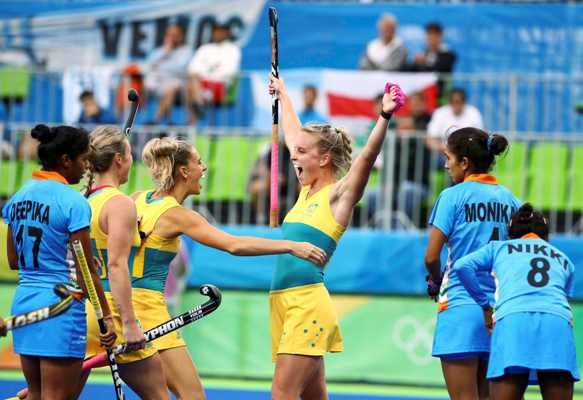 Australia’s Jane Claxton, centre, celebrates with her teammates after scoring against India in the women’s Pool B hockey match at the Rio Olympics on Wednesday