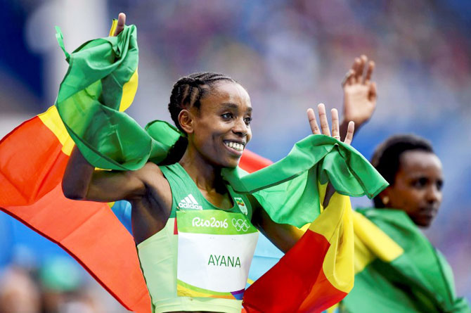 Ethiopia's Almaz Ayana celebrates after winning the Women's 10,000m Final at the Rio Olympics in Rio de Janeiro on Friday