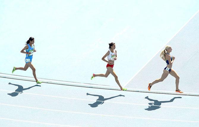 USA's Emma Coburn, Tunisia's Habiba Ghribi and India's Lalita Babar (left) compete in the Women's 3000m Steeplechase Round 1 heat at the Olympic Stadium in Rio de Janeiro on Saturday