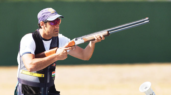 India's shooter Miraz Ahmad Khan competes during the Skeet Mens qualifying round Day 2 at the 2016 Summer Olympics in Rio de Janeiro, on Saturday