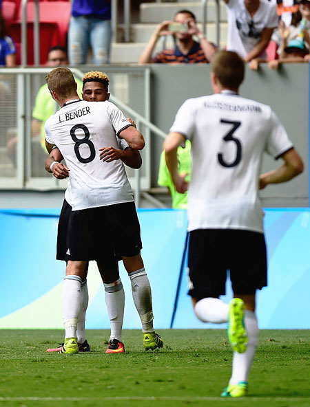 Germany's Serge Gnabry #17 celebrates with teammate Lars Bender #8 after scoring against Portugal in the first half during the Men's Football quarter-final match on Day 8 of the Rio 2016 Olympic Games at Mane Garrincha Stadium in Brasilia on Saturday