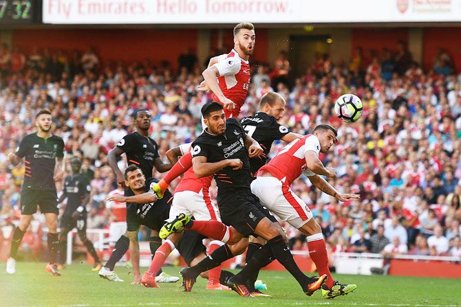 Arsenal's Calum Chambers scores his team's third goal against Liverpool