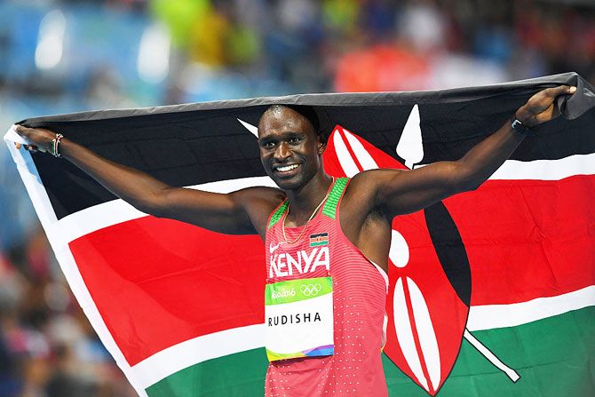 David Lekuta Rudisha celebrates with the Kenyan flag after winning the gold medal in the Men's 800m Final on Monday