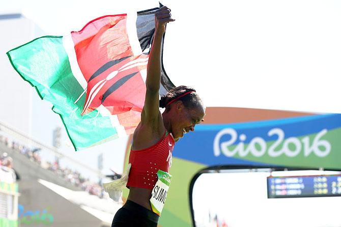 Jemima Jelagat Sumgong of Kenya celebrates after winning the gold medal in the Women's Marathon at the Sambodromo in Rio de Janeiro on Sunday