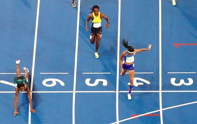Shaunae Miller of the Bahamas throws herself across the finish line to win the gold in the women's 400m final of the 2016 Rio olympics at the Olympic Stadium on Monday