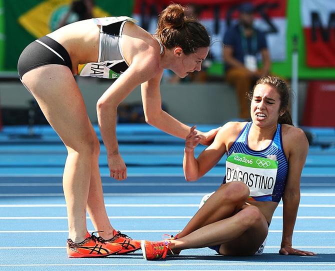 Abbey D'Agostino of the United States, right, is assisted by Nikki Hamblin of New Zealand