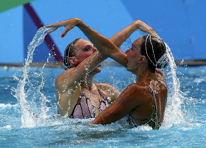 Natalia Ishchenko and Svetlana Romashina of Russia compete in the Synchronised Swimming Duets Free Routine final on August 17