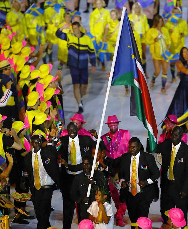 Flag bearer Guor Marial of South Sudan leads his team during the Opening Ceremony of the Rio 2016 Olympic Games at Maracana Stadium in Rio de Janeiro on August 5