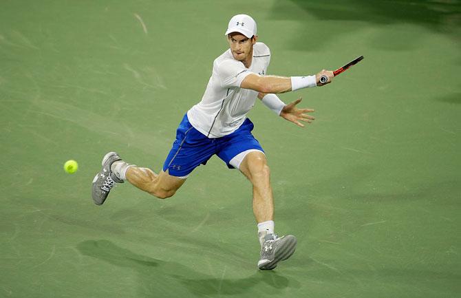 Andy Murray hits a return in his second round match against Juan Monaco at the Western & Southern Open at the Lindner Family Tennis Center in Mason, Ohio on Wednesday