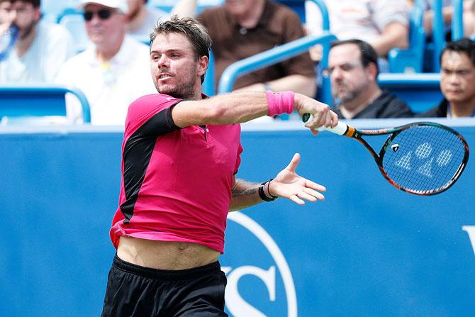 Stan Wawrinka hits a return against Jared Donaldson