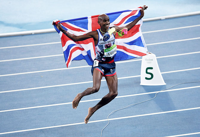 Britain's Mo Farah celebrates after winning gold in the Men's 5000 meter final at the Rio 2016 Olympic Games at the Olympic Stadium on Saturday