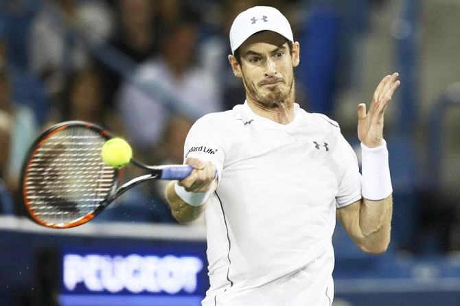 Andy Murray returns a shot against Milos Raonic in the semi-finals of the Western and Southern tennis tournament at Linder Family Tennis Center in Mason, Ohio on Saturday