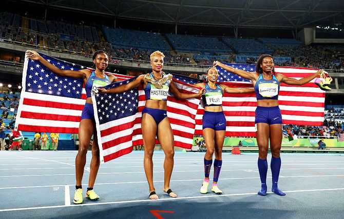 (L-R) Courtney Okolo, Natasha Hastings, Allyson Felix and Phyllis Francis of the United States react after winning gold in the Women's 4 x 400 meter Relay at the Rio 2016 Olympic Games at the Olympic Stadium on Saturday