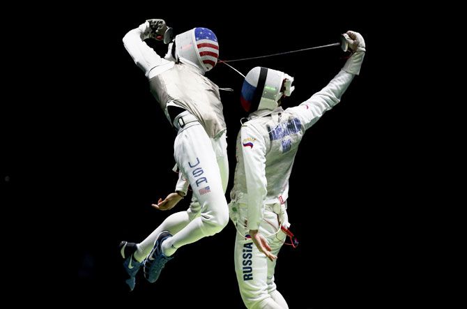 Miles Gerek Meinhardt of USA competes with Artur Akhmatkhuzin  of Russia during the fencing men’s foil team semi-final at Carioca Arena on August 12